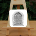 Black and white pencil drawing of a very old arched double door with ornate hinges, a stone surround, and two steps up. Ivy grows part-way up each side of the surround.