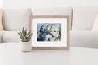 Mockup of art in frame on table.