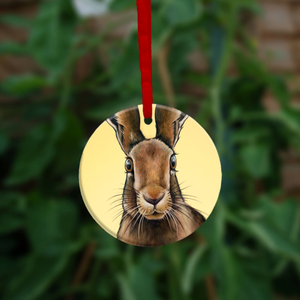 The reverse side of the ornament, showing just the head of the hare, looking directly at the viewer.