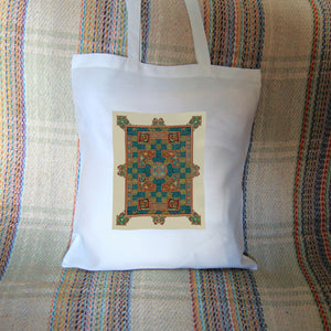 An intricate rectangular design incorporating dozens of Celtic knots, with Celtic-style animals around the perimeter. Colours are orange, beige and blue.