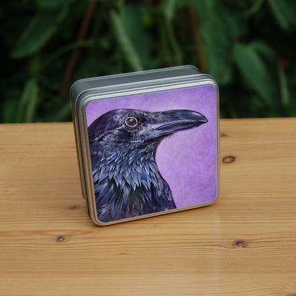 A side view of the head and neck of a raven with lots of feather detail. The raven is coloured black with purple shading, and the background is mottled purple.