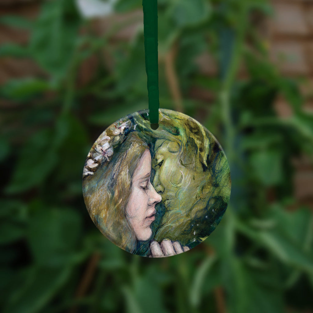The other side of the ornament, showing a close-up of the woman and green man.