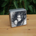 Square metal tin: Pencil illustration of the head and shoulders of a young woman looking back over her shoulder. She has a mass of hair sticking out in all directions around her head and down her front. Leaves are woven - or perhaps stuck - in her hair.