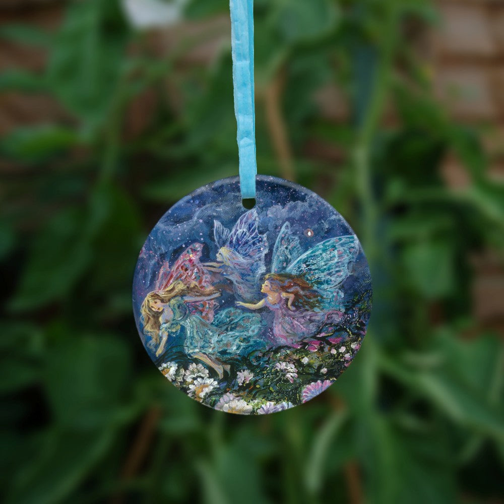 The reverse side of the ornament. Fairies dancing in a field of flowers.