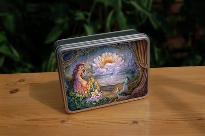 A woman wearing a long gown and with very long hair decorated with large flowers, sits and leans against the branch of a tree looking out to sea where a tall sailing ship can be seen approaching. A small boat rests on the shore. Behind the ship, a large many-petalled white flower appears from behind a distant cloud. To the right a fantasy city rises from the rock. Two colourful birds with long tails watch the ship approach.