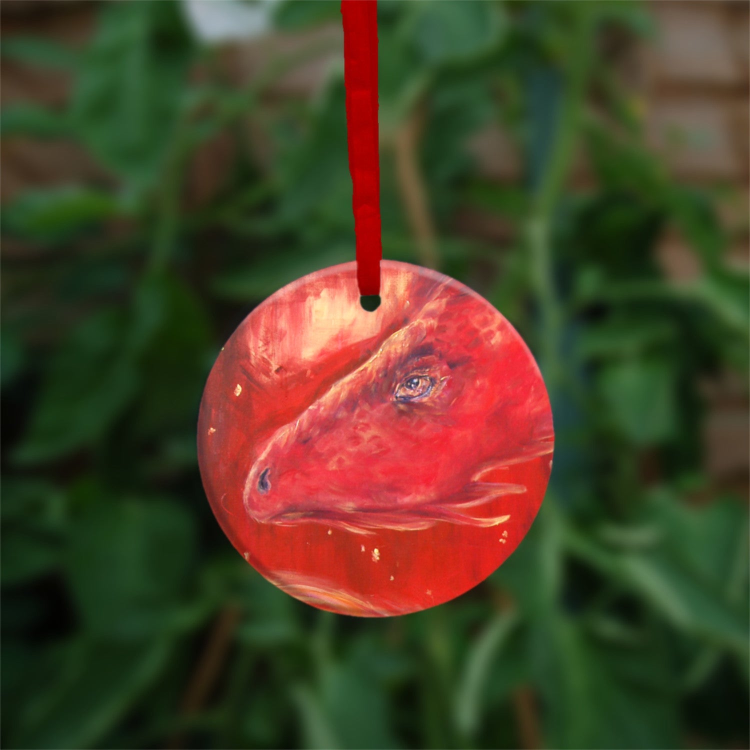 The reverse side of the ornament, showing just the dragon's head.