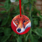 The reverse side of the ornament, showing a close-up of the fox's face.