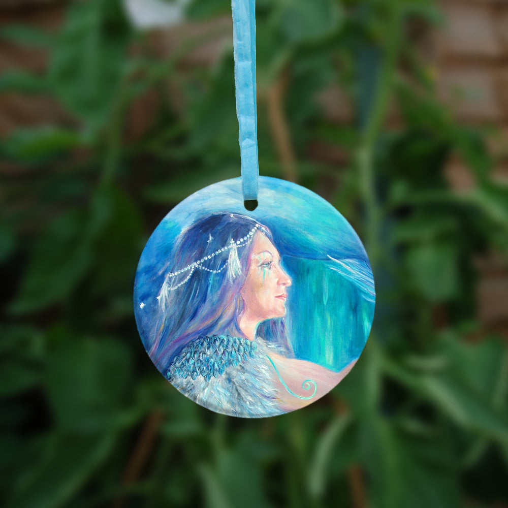 The reverse side of the ornament, showing just the woman's head and shoulder.