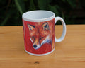 The head of a red fox looking at an angle towards the viewer, coming into the painting from the right. A pale-coloured spiral is coiled on their forehead. The background is red.