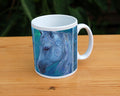 The head and mane of a horse, head facing mostly to the right. The horse is painted entirely in blue apart from a deep brown eye, with two spirals on and above the cheek. The background is blue-green.
