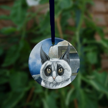 The reverse side of the ornament, showing just the head of the cat.