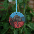 The reverse side of the ornament, showing just the cat on the back of the chair.