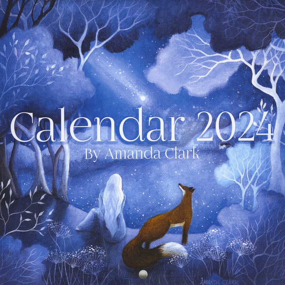 Cover of the calendar featuring a woman sitting in woodland with a fox standing behind, both looking towards a shooting star. Colours are mostly blues, with the fox standing out in red/brown.