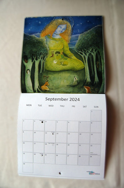 Page for September 2024, featuring a red-haired woman sitting on the ground. Her dress incorporates green fields. She is much larger than the row of trees in front of her. A badger, deer and weasel sit among the trees. The calendar opens up to show the image at the top, with the calendar section below.