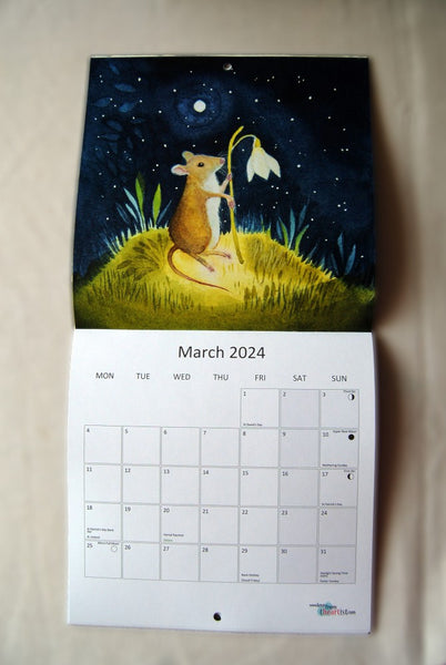 Page for March 2024, showing a red and white mouse sitting on a small hill holding a snowdrop in its paws. The calendar opens up to show the image at the top, with the calendar section below.