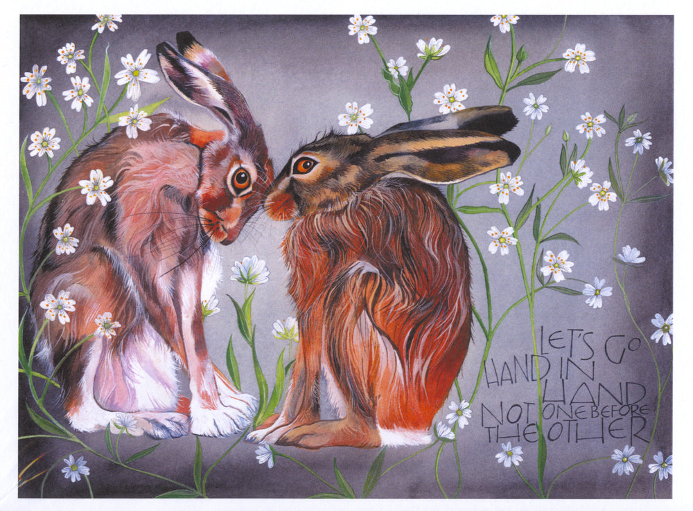 Two hares with red fur and white feet sit on their haunches facing each other, heads touching. Green stems with small white flowers at the end surround them. The background is shades of grey. An inscription at the bottom right reads, "Let's go hand in hand not one before the other".