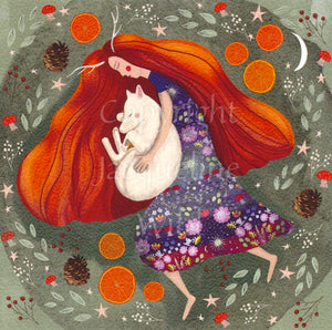 A woman with very long, flowing red/orange hair and wearing a long floral dress cuddles a sleeping white fox or wolf. Two small stag horns protrude from her head. She is surrounded by pine cones, slices of oranges, leaves, berries and mushrooms. The overall background is sage green.