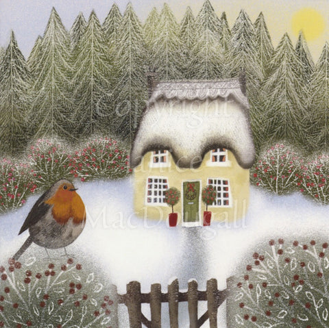 The viewer looks over a wooden garden gate towards a double-fronted thatched cottage. Red-berried hedges surround the snow-covered garden, and a robin sits on the hedge to the left of the gate. A conifer forest provides a backdrop.