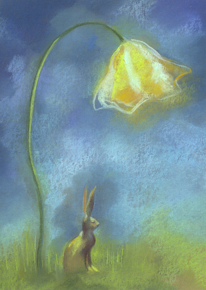 A brown hare sits in grass, ears upright, beneath a much larger orange/yellow flower hanging down from a long stem like a lamp. The hare and surroundings appear to be lit by the flower. The sky is shades of deep blue with sweeps of pale cloud.