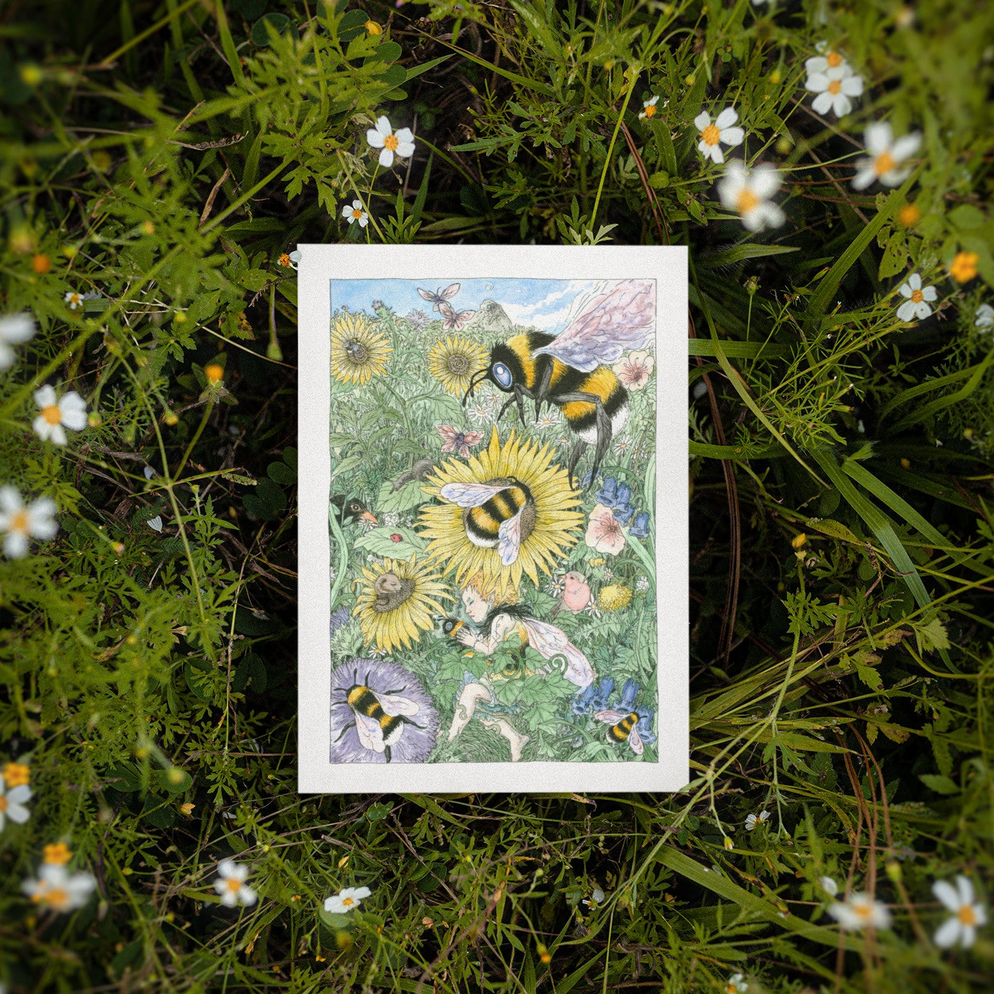 Greeting card featuring bees and flowers on a grassy background
