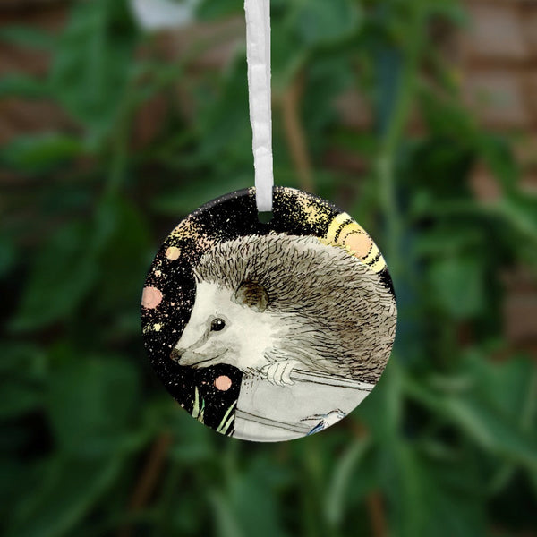 The second side of the ornament which shows just one hedgehog.