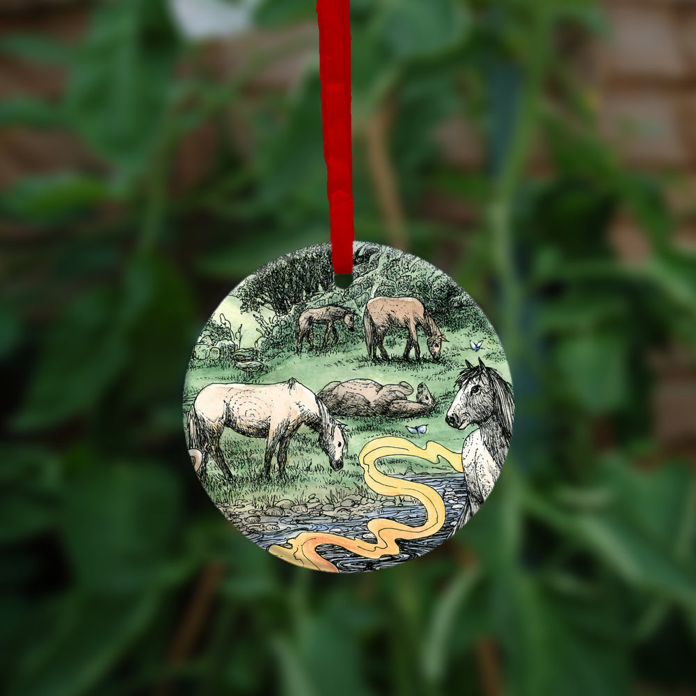 The second side of the ornament.  Horses grazing in a field next to a stream.