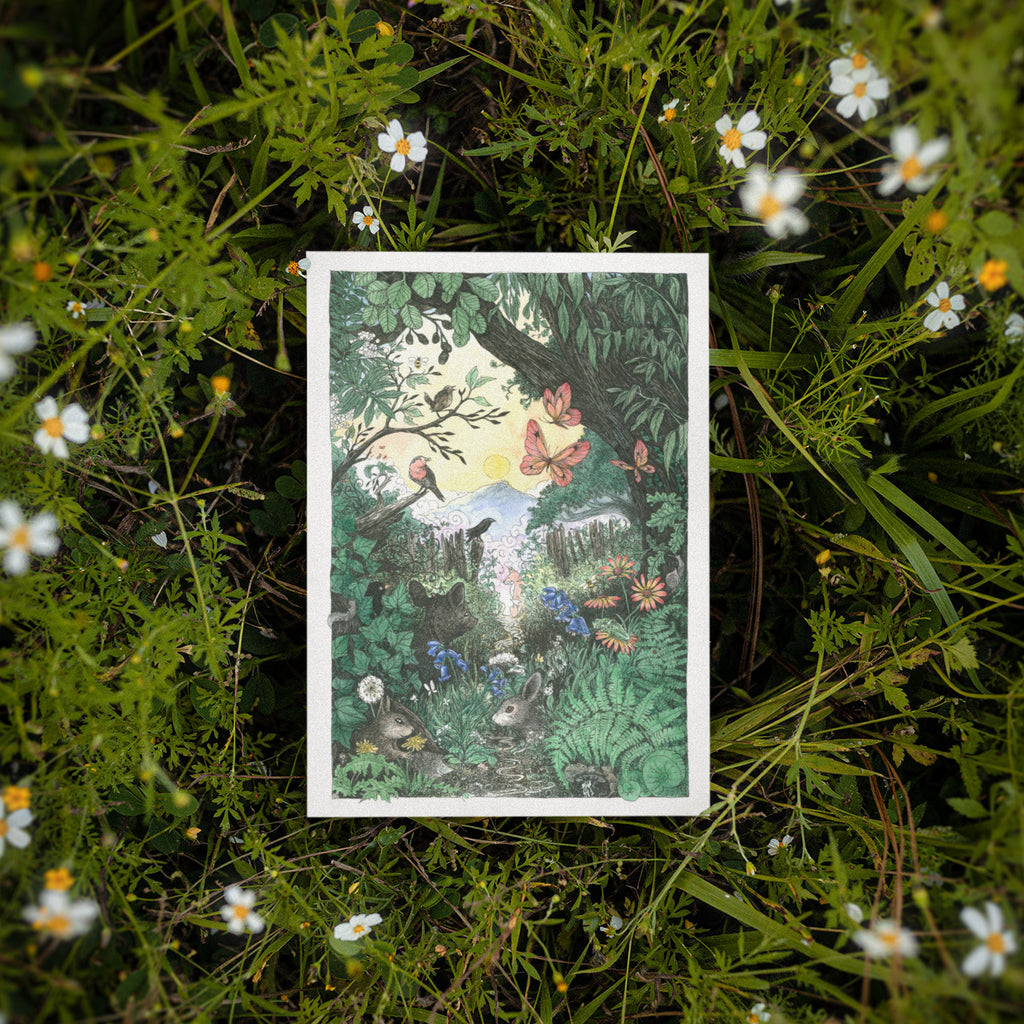 Illustrated card with a forest scene surrounded by greenery and flowers