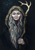 An older woman with blue eyes stands facing the viewer. Her head is covered by a brown hood, and her long grey hair, some of it braided with blue braid, falls down below her face. She holds a staff, topped with a deer antler, upright in one hand. A sea of stars shine behind her.
