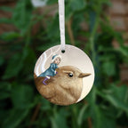 The other side of the ornament, showing a close up of the fairy and the head of the wren.