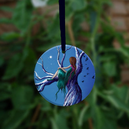 The other side of the ornament, showing a close up of the girl sitting in the tree.