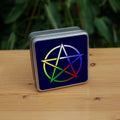 Illustration of a pentagram which is multi-coloured, starting white at the top, then clockwise through blue, red, green and yellow. The background is dark blue.