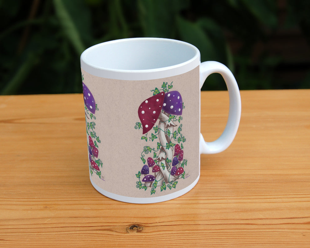 Two toadstools with long pale stems are twined together. The cap of one of them is red with white spots, the other purple with white spots. More small toadstools are dotted around the foot of the pair, and leafy green tendrils twine around and up the main pair. The background is a mottled beige colour.
